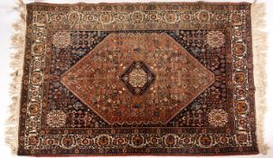 A Hamadan rug, the rust hexagonal field with a central indigo stepped octagonal pole medallion,
