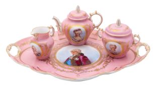A Serves-style part cabaret set painted with Royal portraits reserved on a gilded pink ground,
