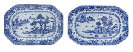 A pair of Chinese blue and white octagonal dishes painted with a lake scene with huts,