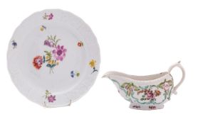 A Derby moulded sauceboat and a Meissen plate the sauceboat painted in 'cotton stem painter' style,