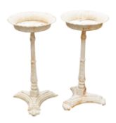 A pair of Victorian painted cast iron conservatory plant stands,