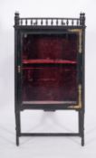 A Victorian ebonised wood and glazed display cabinet in Aesthetic Movement style,
