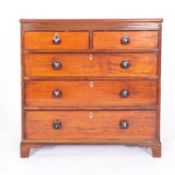 A late George III mahogany chest of drawers, early 19th century; with line inlaid top,