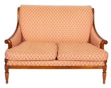 A walnut and upholstered sofa in late 18th century taste, by Wesley-Barrell,