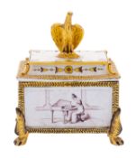 A Continental faience casket and cover with eagle finial and claw feet, painted in yellow,