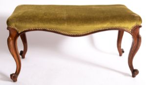 A carved rosewood and upholstered long stool in 18th century taste,