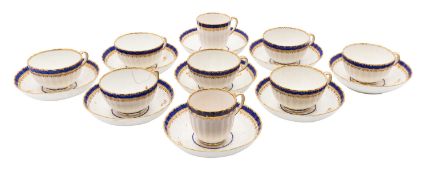 A Derby blue banded part tea and coffee service decorated with deep blue bands within gilt dentil