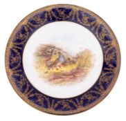 A Royal Worcester dessert plate decorated with partridges in a landscape vignette within a blue and