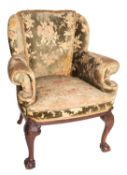 A mahogany and upholstered armchair in George II style,