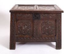A carved oak coffer, possibly Welsh, later 17th century; the hinged cover,