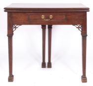 A George III mahogany tea table,
