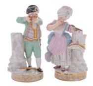 A pair of Meissen figures of a boy and girl after the models by Acier, the boy aiming a crossbow,