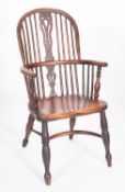 An elm and yew Windsor elbow chair,
