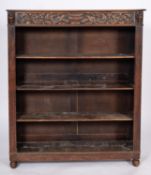 A Victorian carved oak open bookcase,