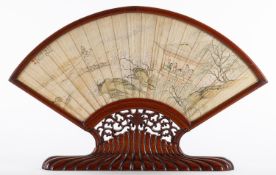 A pair of Chinese presentation fan papers in hardwood frames with carved stands one signed Hailou
