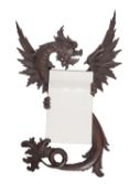 A French carved and stained wood wall mirror modelled with a dragon, probably by Gabriel Viardot,