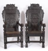 A pair of carved oak high back elbow chairs in 17th century style,