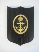 A Scandinavian wardroom badge for the Kustflottan (Coastal Fleet): gilt on ebony plinth,