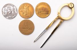 A group of three reproduction Nelson Commemorative medallions in a mahogany case,