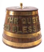 An Elizabeth II brass bound oak rum barrel,