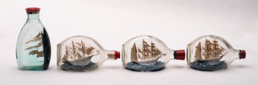 Four various model ships in Dimple Haig bottles, including one of 'Herzogin Ceclie' clipper,