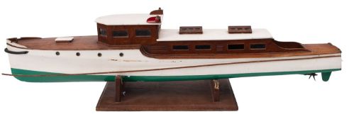 A scale model of an early 20th century motor yacht ,