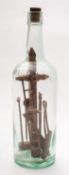 A late 19th early century set of miniature Shipwright's tools in bottle.