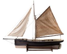 An Edwardian pond yacht, fully rigged over pine deck with fittings,
