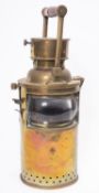 A WWI period circular brass signal lantern, maker E G & S,