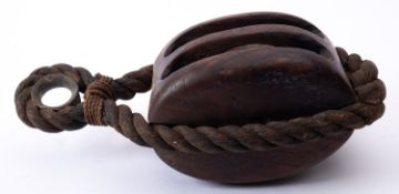 A 18th/ early 19th century century ship's block, with rope work strop,
