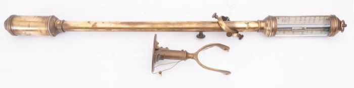 A reproduction brass ship's stick barometer with brass wall mount,