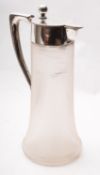 A late 19th century German silver and glass presentation claret jug, post 1886 .
