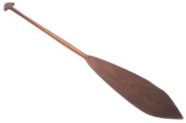 A late 19th/early 20th century Maori paddle, the plain broad leaf shaped blade, with tapering shaft,
