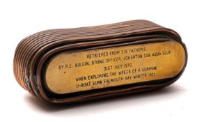 A WWI U-Boat battery coil paperweight, inscribed 'Retrieved from six fathoms by R. E Bulgin.