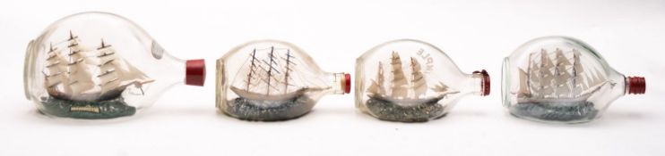 Four various model ships in Dimple Haig bottles, various sizes.