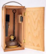 A microscope oil lamp illuminator, maker C Baker, London, lacquered brass foot stamped as per title,