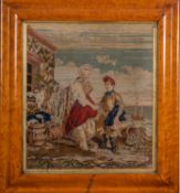 A Victorian needlework of a young sailor and his mother, in a swept maple frame, 44 x 39cm.