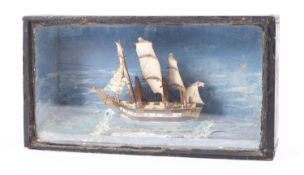 A Victorian paper Christmas card model of a frigate in a glazed case,