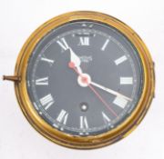 A Smiths 'Astral' submarine brass bulkhead clock, with black dial ,