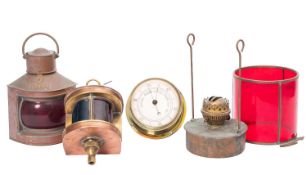 Three small copper ship's lamps, a bulkhead barometer,