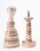 Two Isle of Wight Alum Bay sand souvenirs, one in the form of a lighthouse with variegated bands,