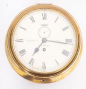 A brass bulkhead clock, maker C Johnson, West ham, London,
