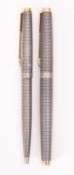 A silver coloured Parker 75 fountain pen and ballpoint set,