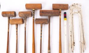 A composite croquet set, comprising two mallets by Ayres, London and five other mallets, four ball ,
