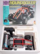 A boxed BMW-M1 radio controlled car, with a boxed Houndboxer radio controlled car,