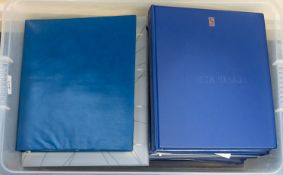 A collection of stamps - 12 albums in a clear plastic box,