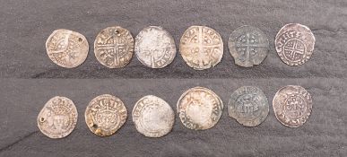 A group of silver pennies, King John Henry III, Henry V (holed), Edward II, Richard II.