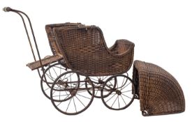 A late Victorian wicker child's pram, with foldover hood and wooden seat ,