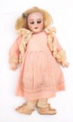 A late 19th century German bisque head doll, applied blonde wig , brown glass sleeping eyes ,