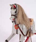 A late Victorian/early Edwardian Rocking Horse of small size inset glass eyes with open mouth,